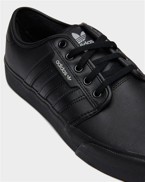 all black adidas shoes men.